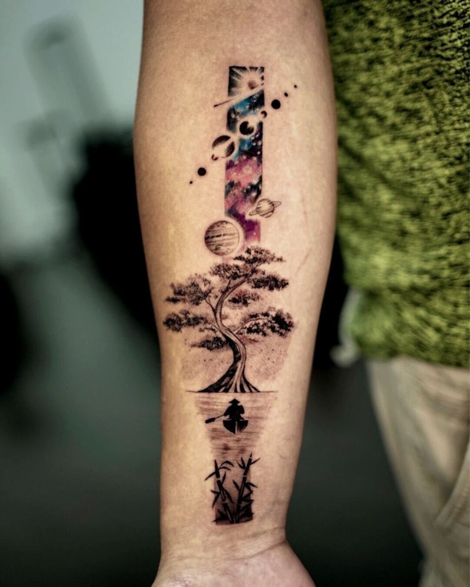 A unique tattoo featuring a tree and planets.
