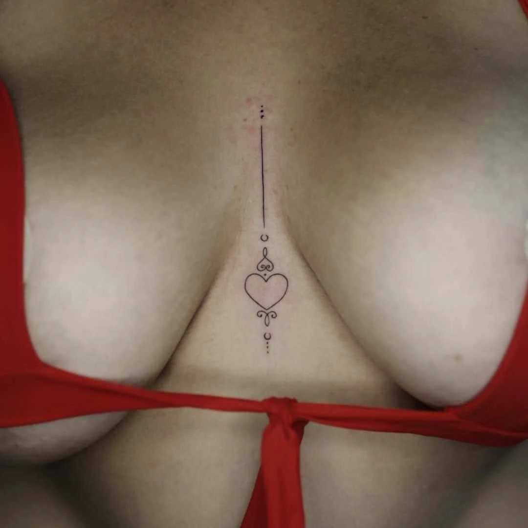 Minimalist tattoo of a heart on the back