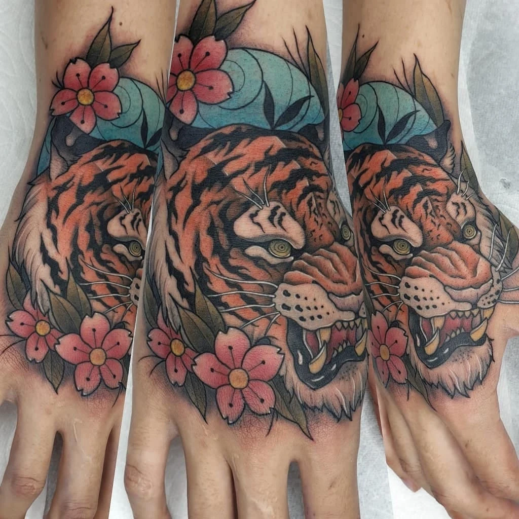 Colorful tiger tattoo on hands with flowers
