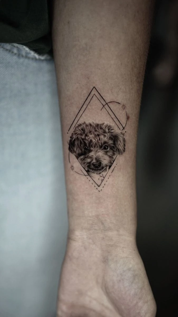 Detailed tattoo of a dog's face within geometric patterns