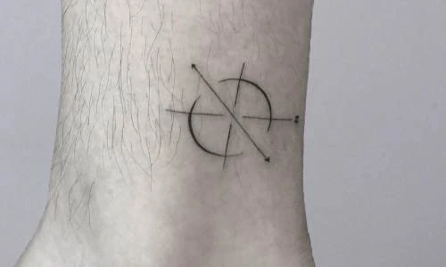 Minimalistic tattoo design featuring circular pattern and arrows.