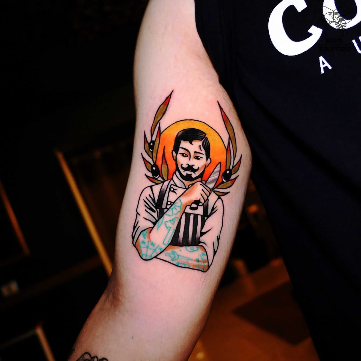 Tattoo of a barber with stylized design