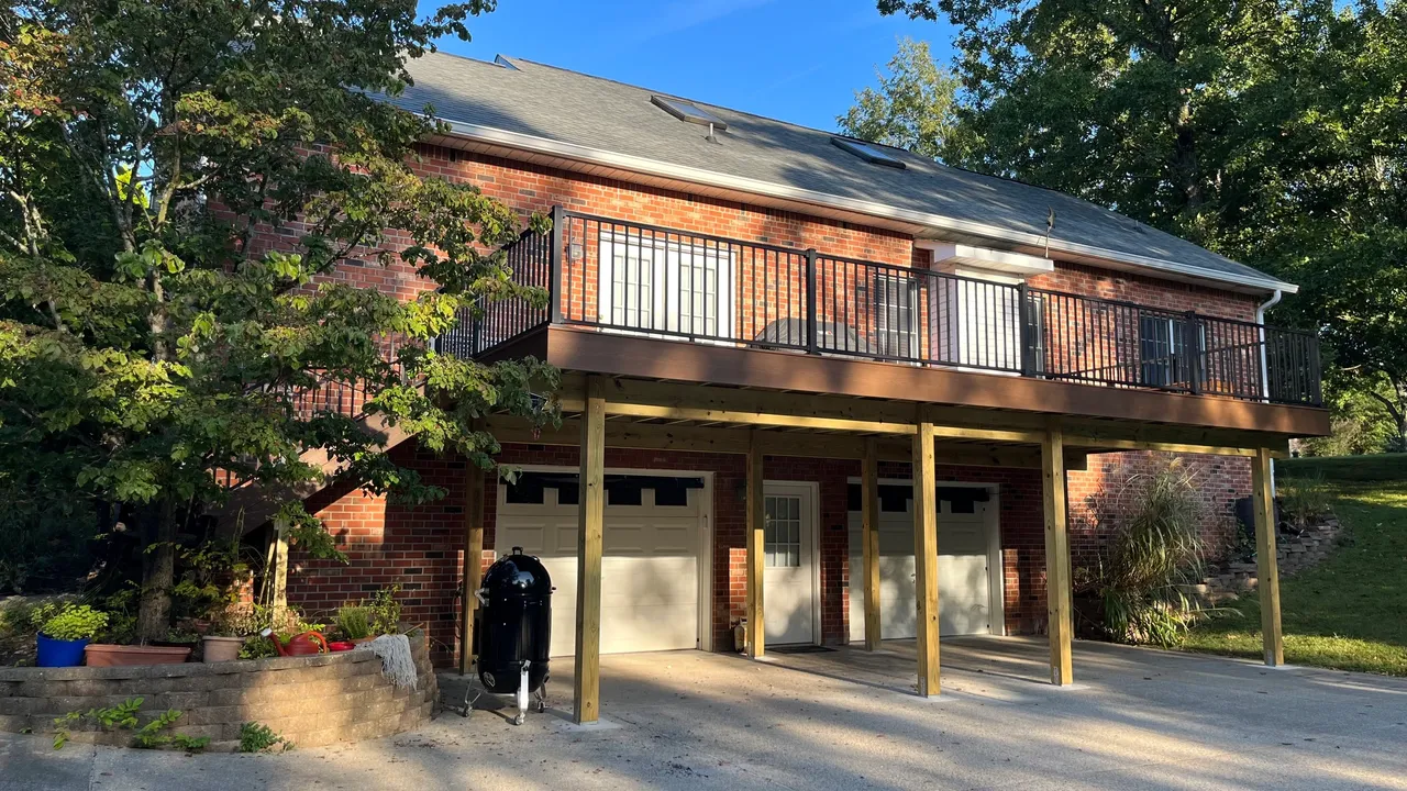 Modern two-story brick house with balcony and garage