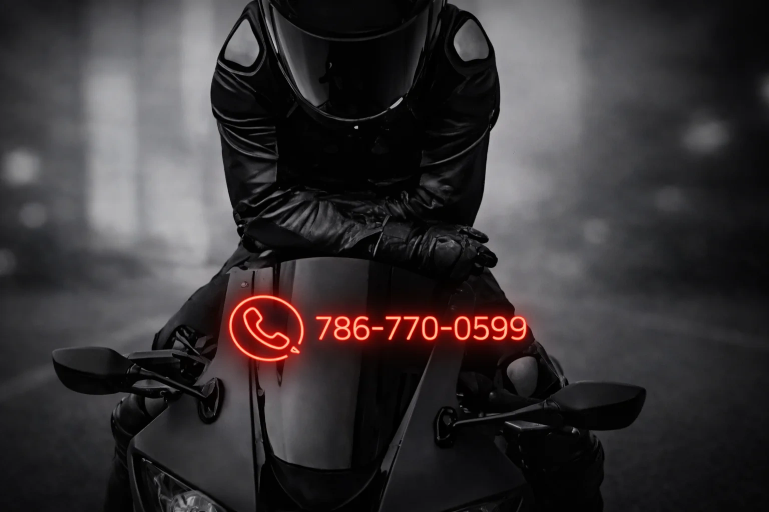 Motorcycle rider in black leather with contact number