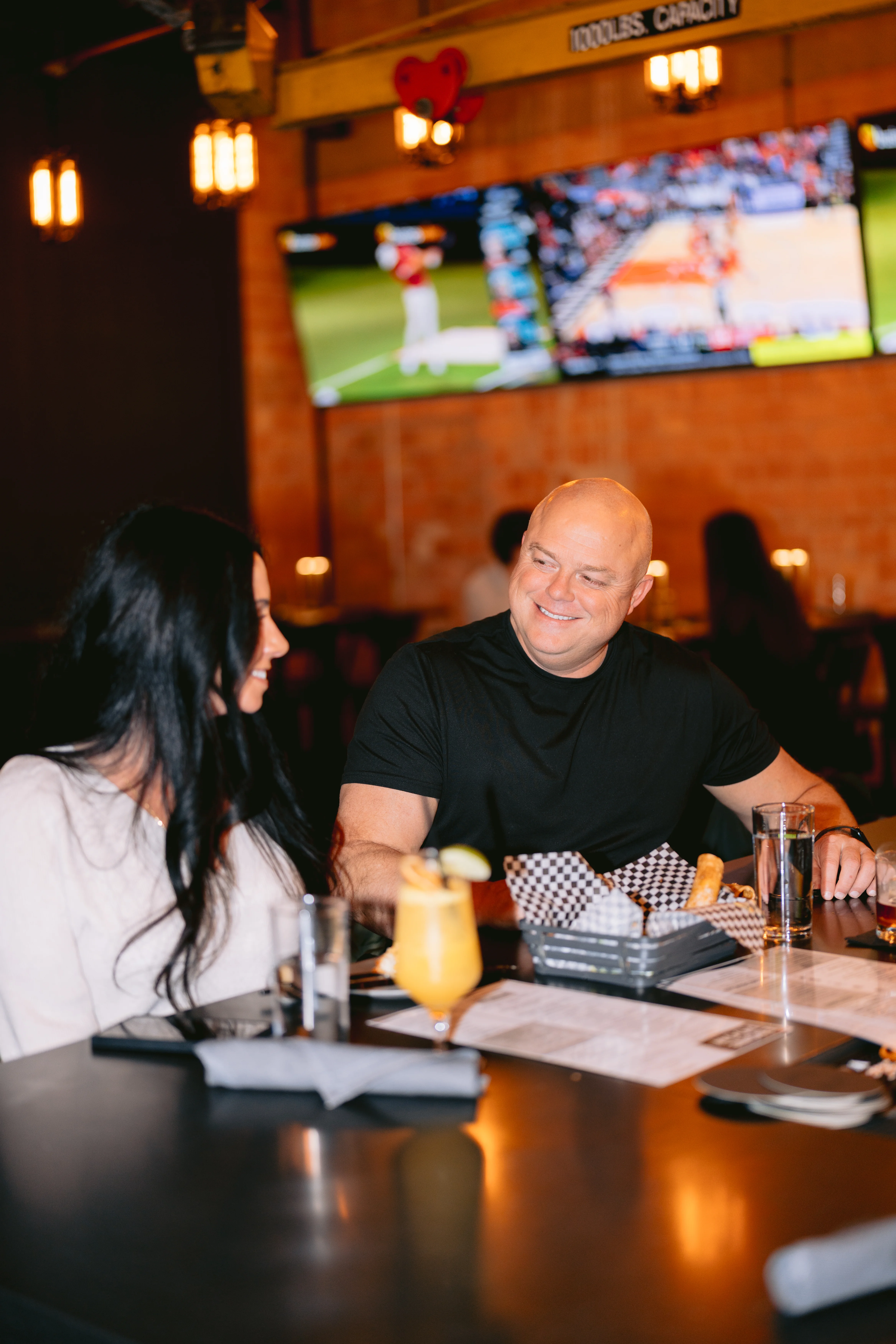 couple-enjoying-meal-at-restaurant