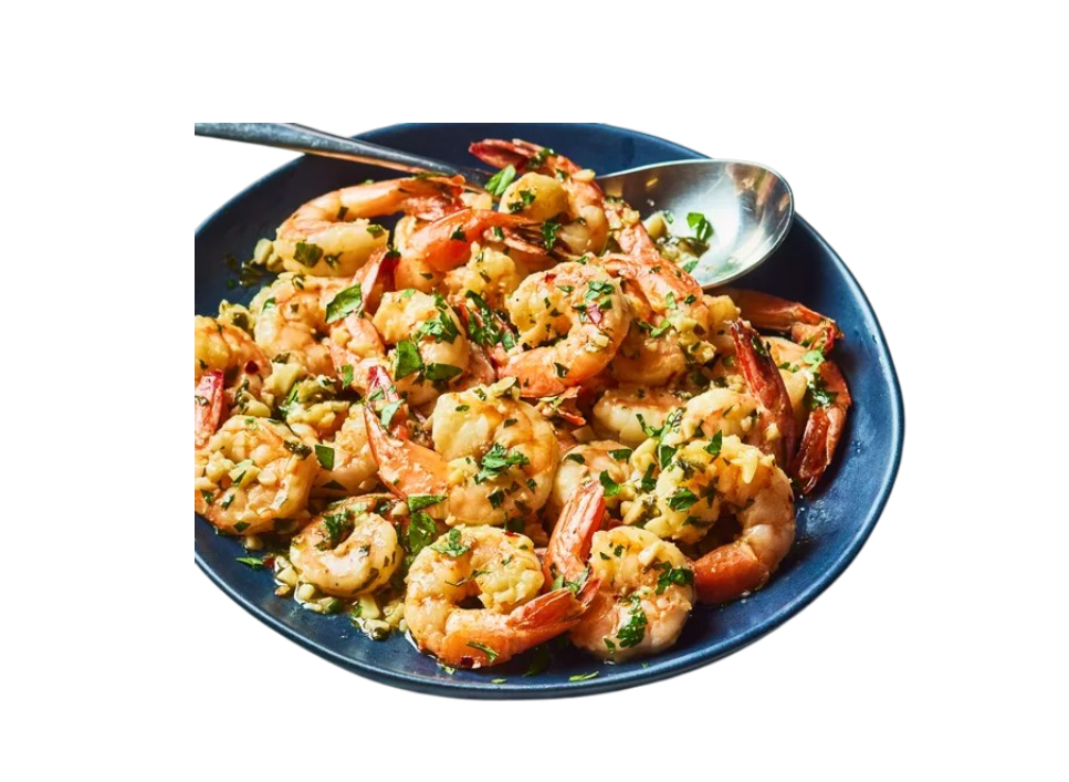 Plate of garlic butter shrimp with herbs