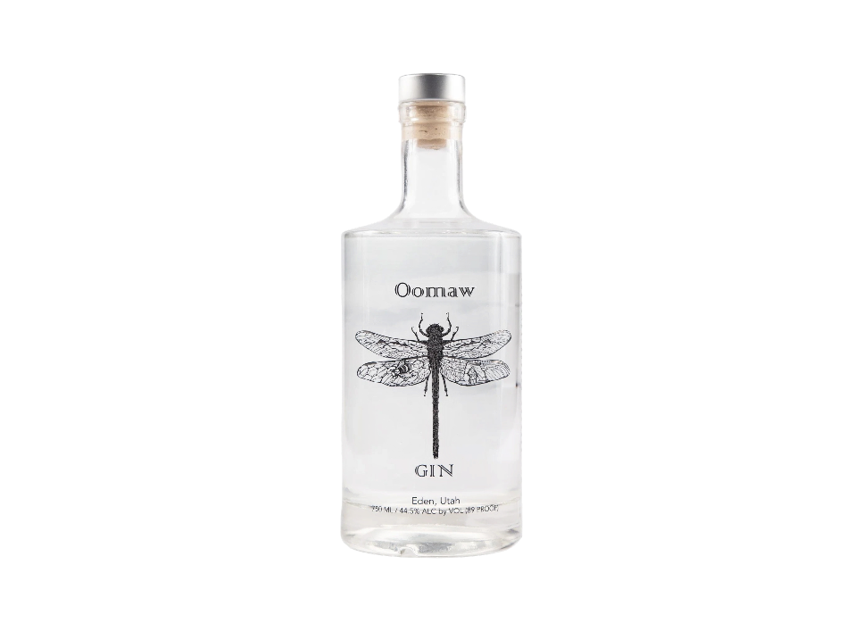 Oomaw gin bottle with a detailed dragonfly design.