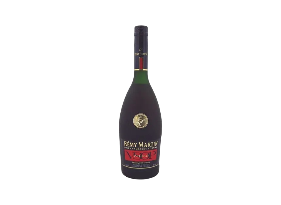 A bottle of Rémy Martin VSOP cognac on a dark background