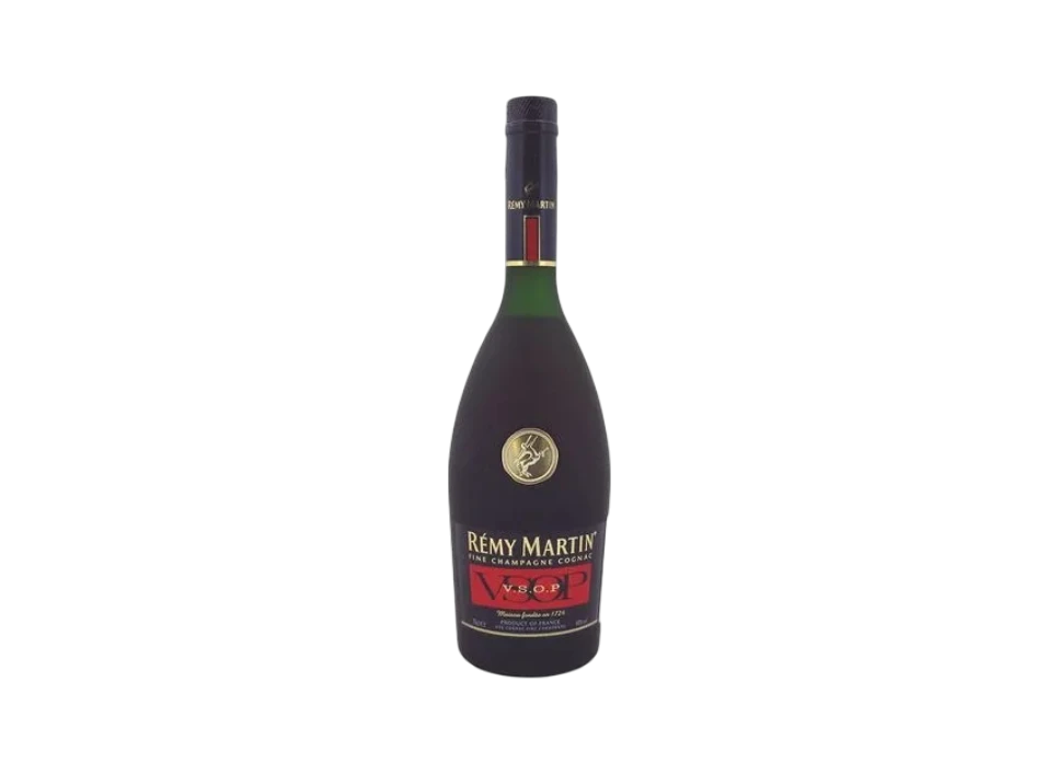 A bottle of Rémy Martin VSOP cognac on a dark background