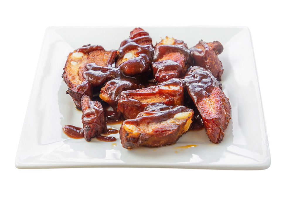 Delicious pork ribs with barbecue sauce served on a plate.