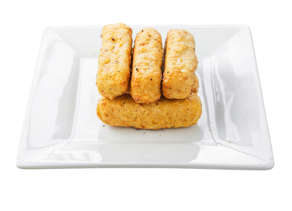 Plate of golden-brown veggie sticks stacked on a white plate