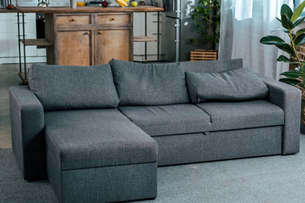 Stylish gray sectional sofa in a bright room