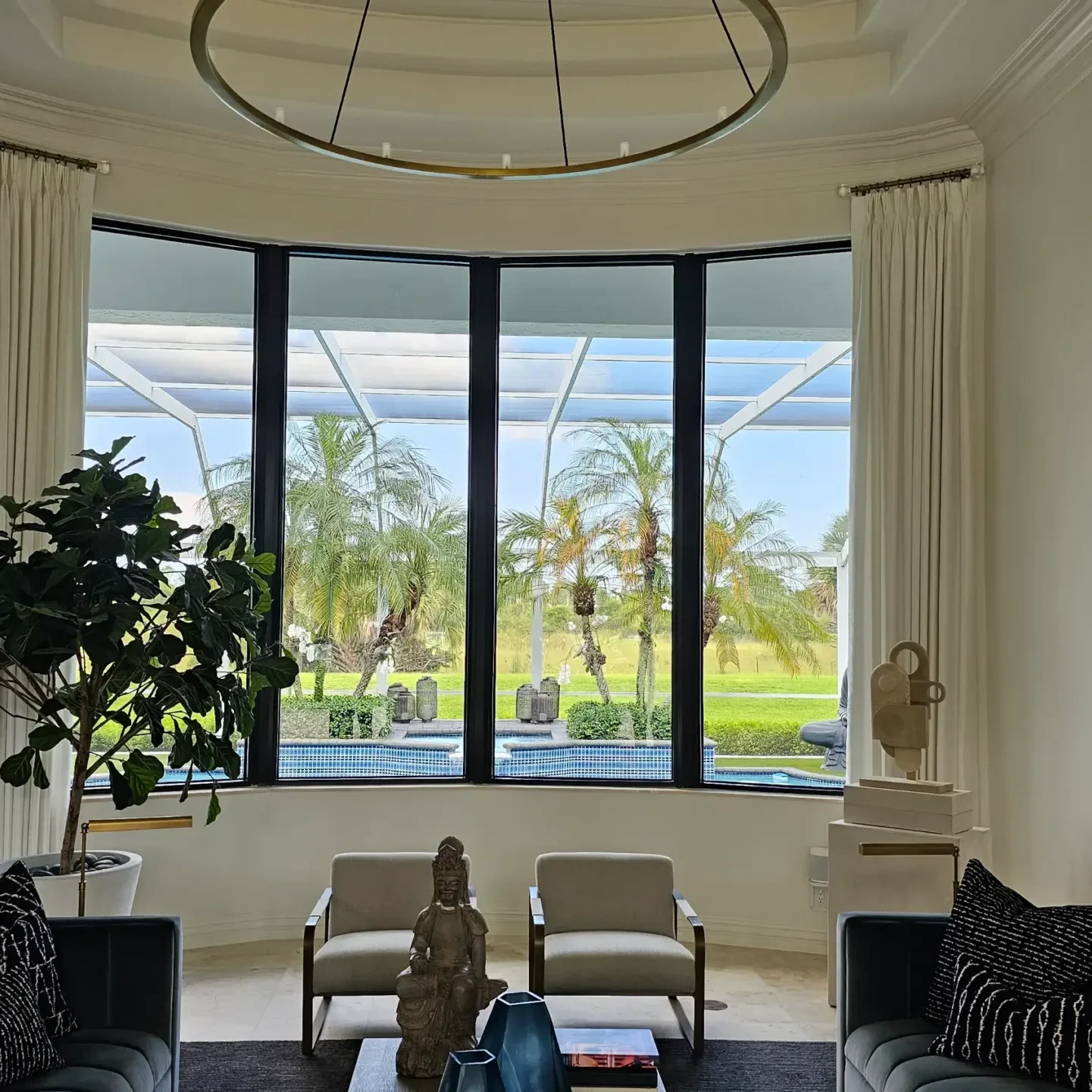 Modern living room with palm trees view