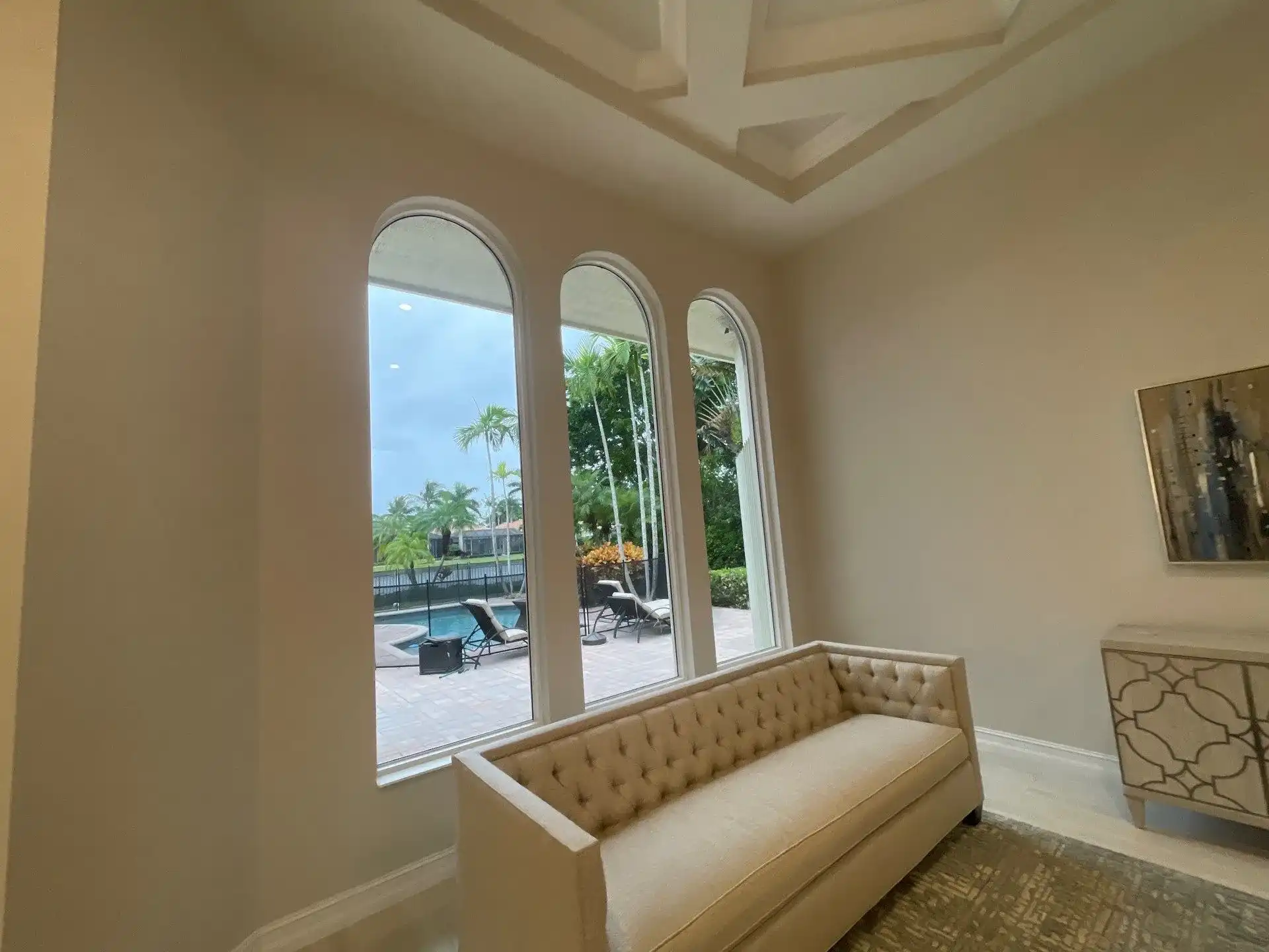 Elegant living room with a view of a pool