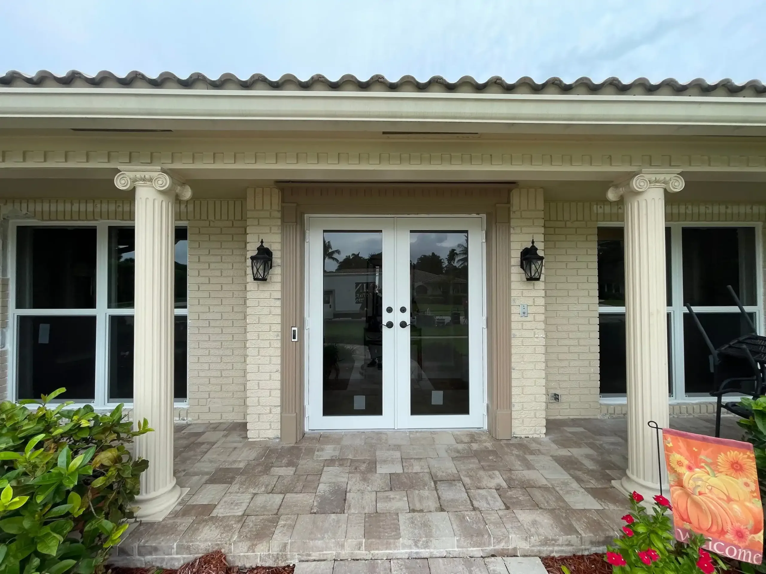 Elegant entrance with double doors and pillars