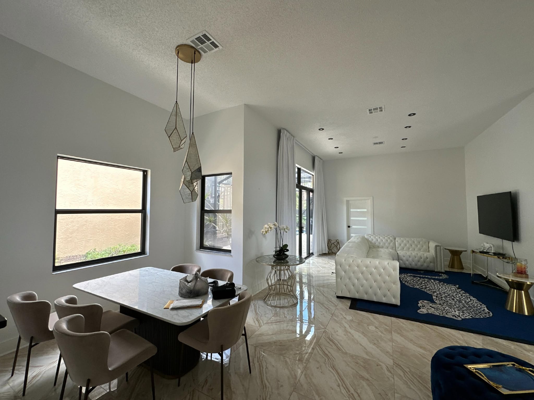 Modern living room and dining area with elegant furniture