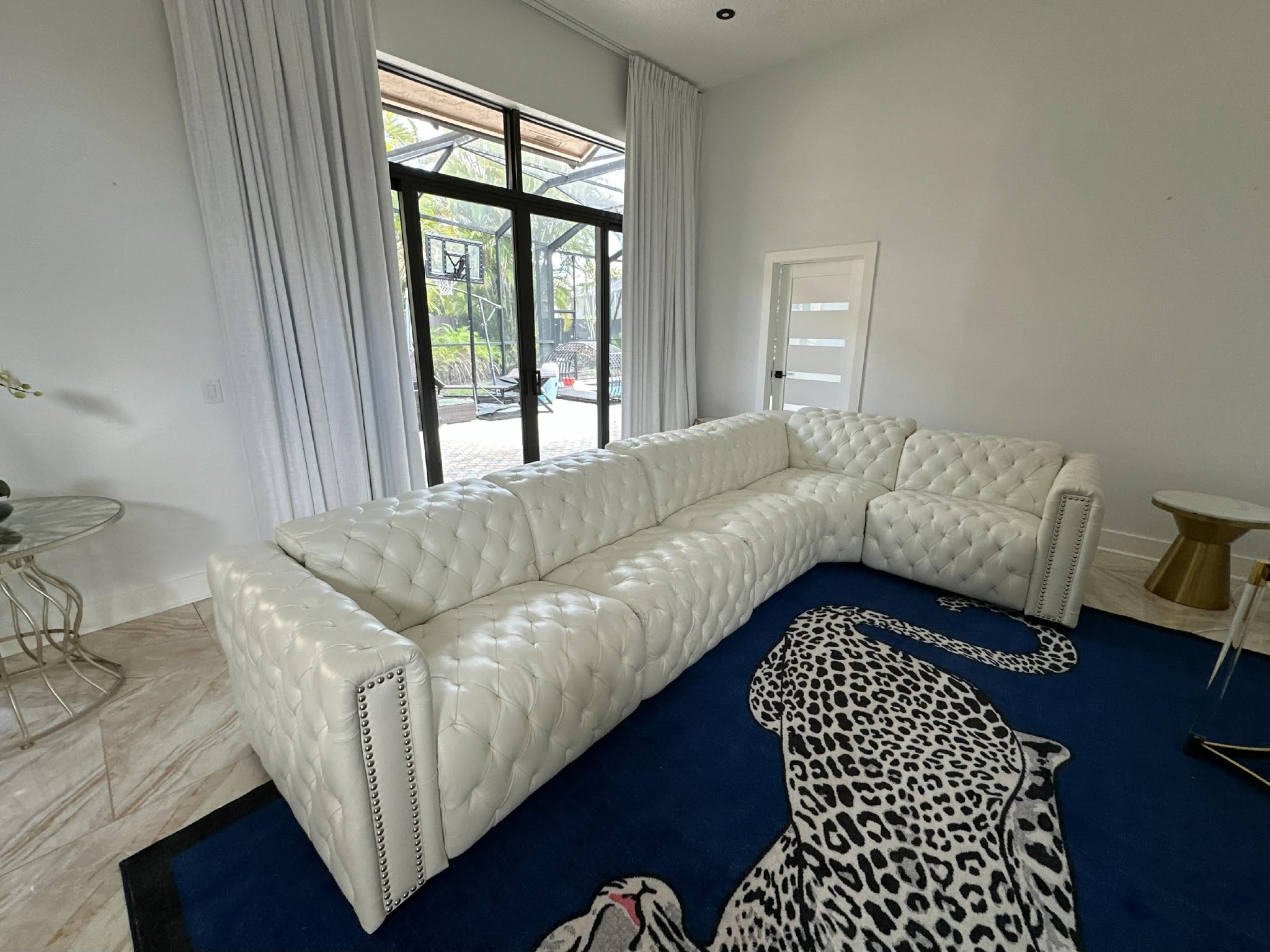 Modern white sectional couch in stylish interior