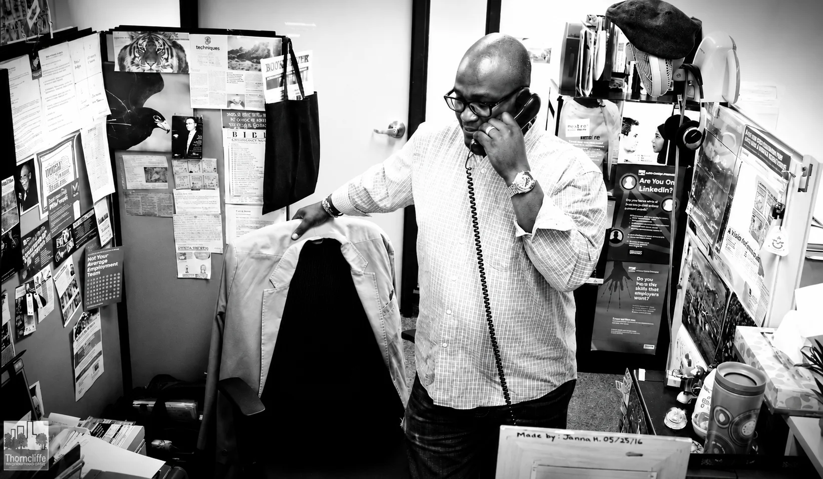 Businessman talking on the phone in a cluttered office