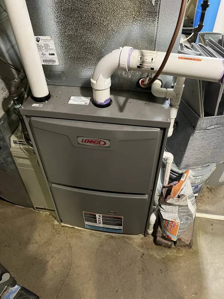 Lennox gas furnace in a residential basement setting.