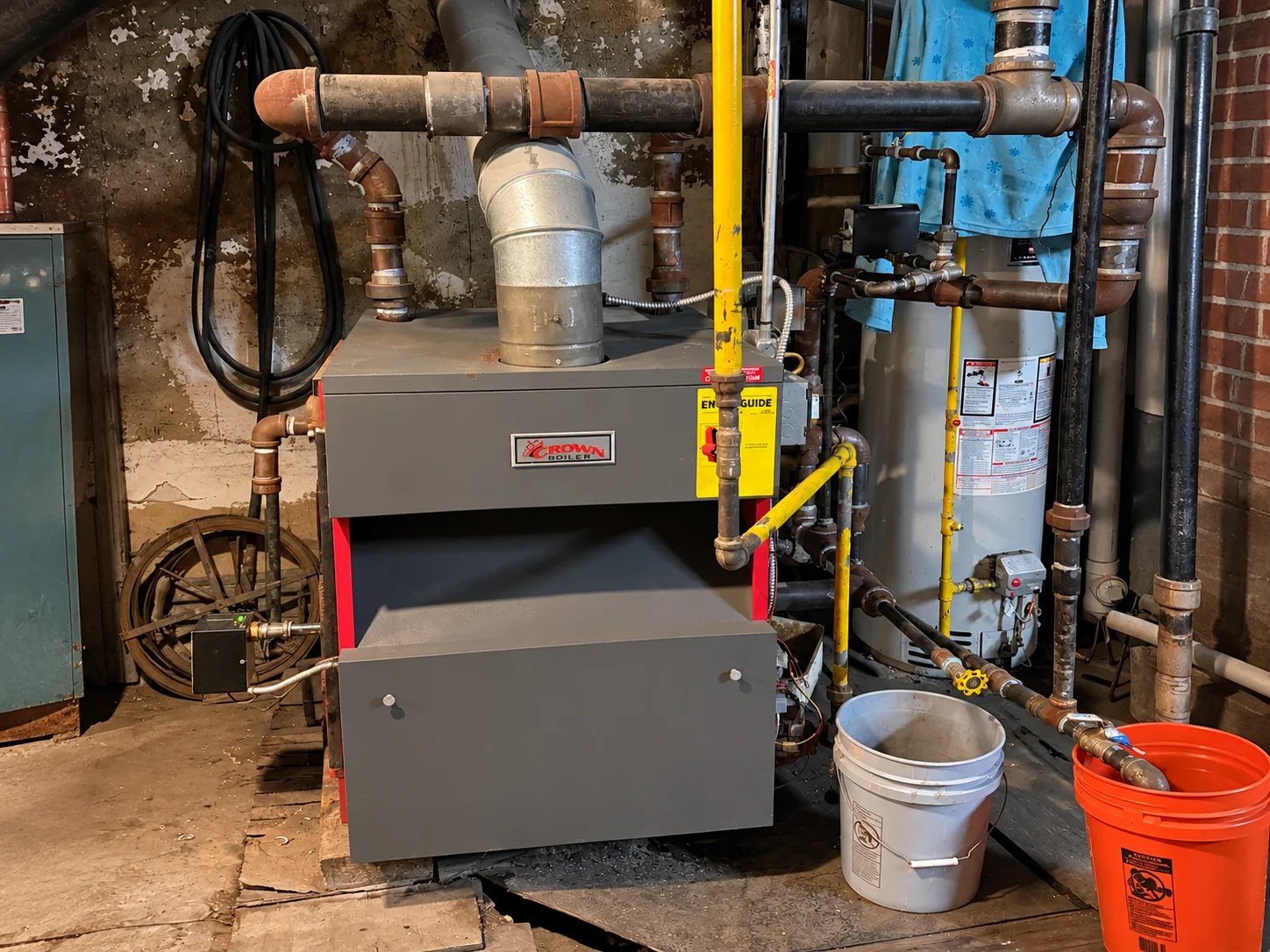 Industrial boiler system in basement workspace