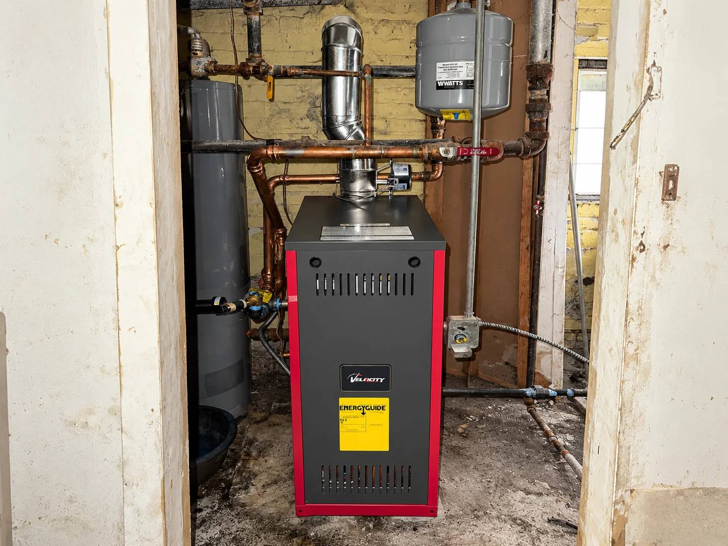 Modern hot water boiler in a utility room.