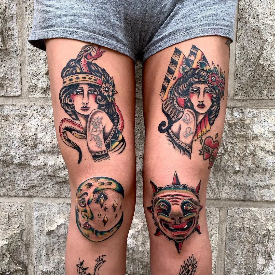 Colorful thigh tattoos featuring female figures, sun, and moon designs.