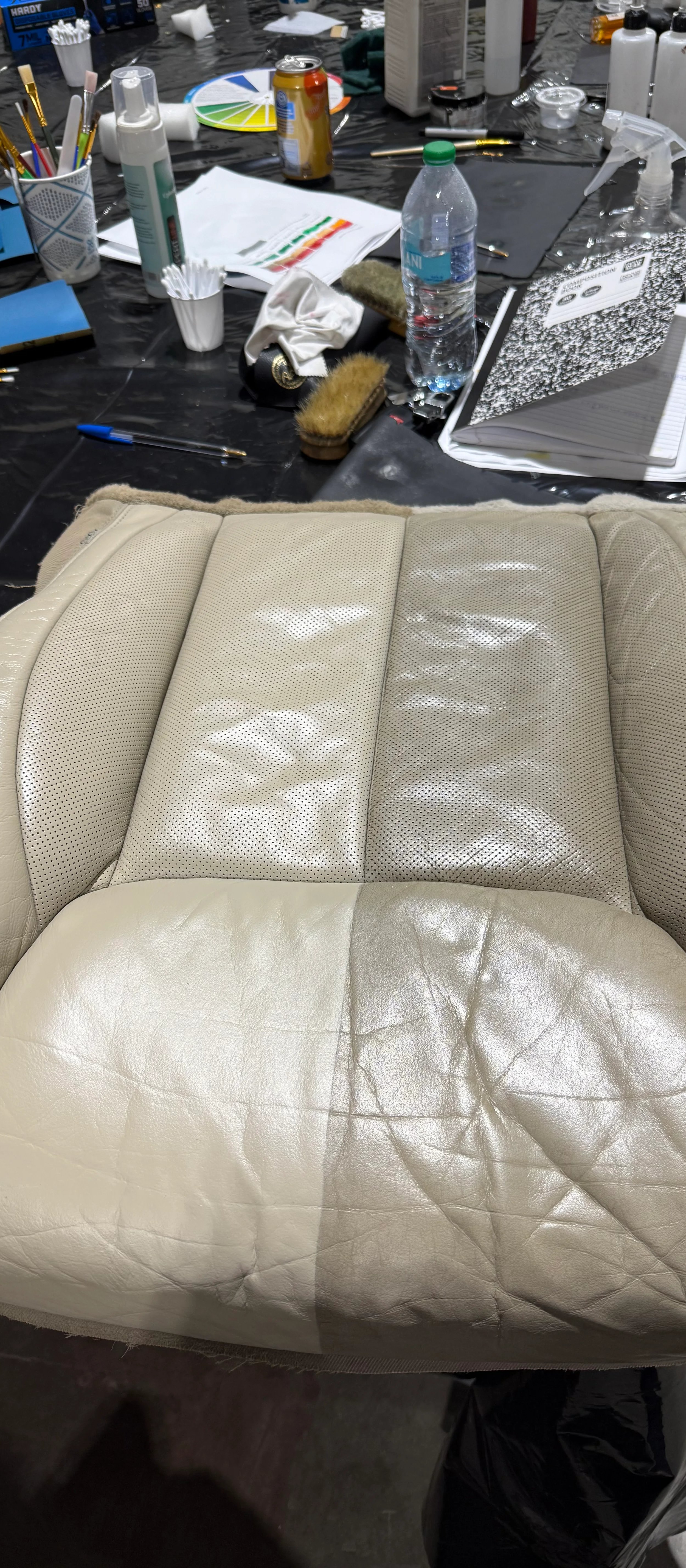 Worn leather car seat before and after restoration