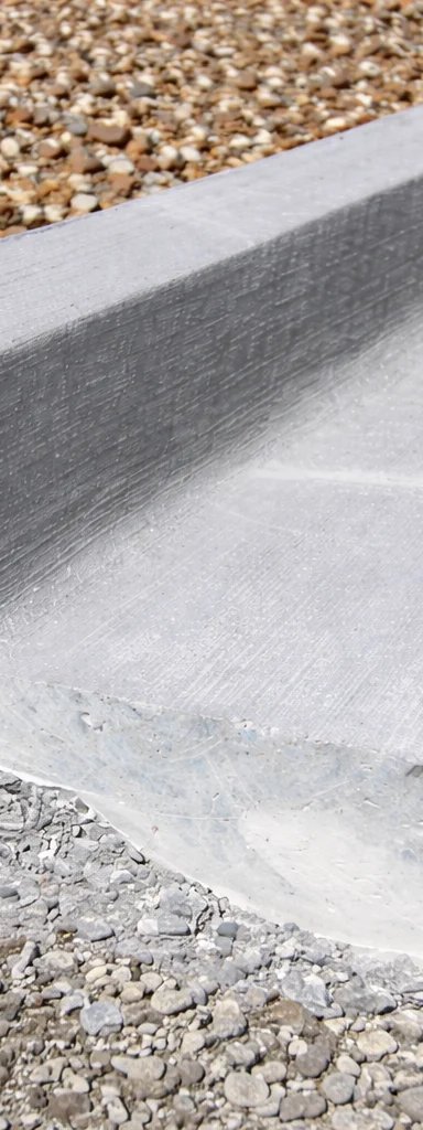 Concrete curb on gravel construction site