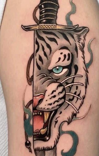 Tattoo of a tiger emerging from a sword on an arm