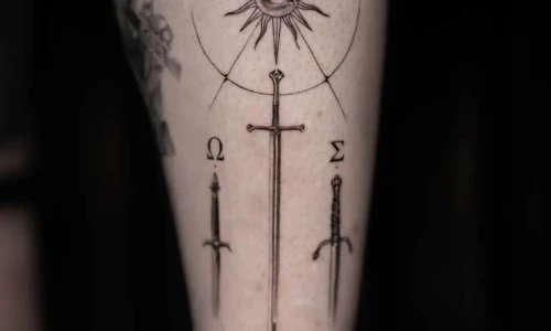 Detailed tattoo featuring swords and symbols.