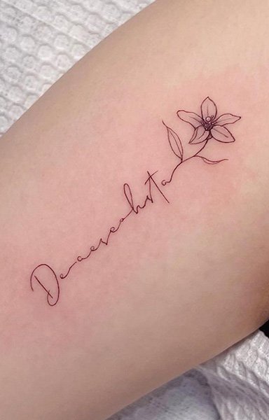 Minimalist floral tattoo design on skin