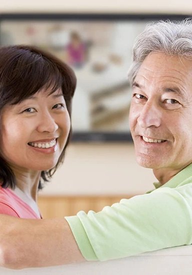 Smiling couple enjoying time together at home