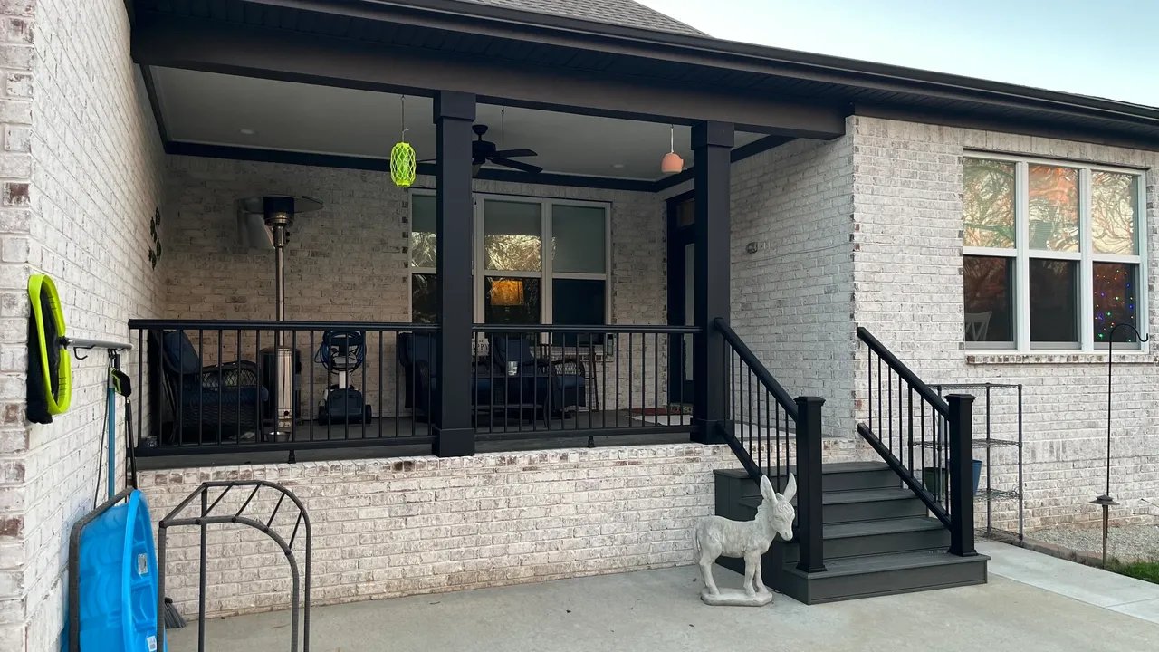 Modern home exterior with porch and decorative elements.