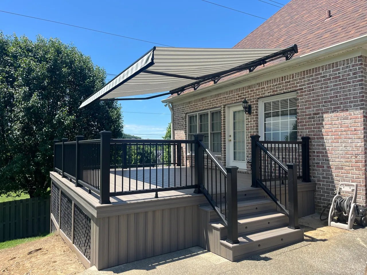 Modern deck with retractable awning and handrails