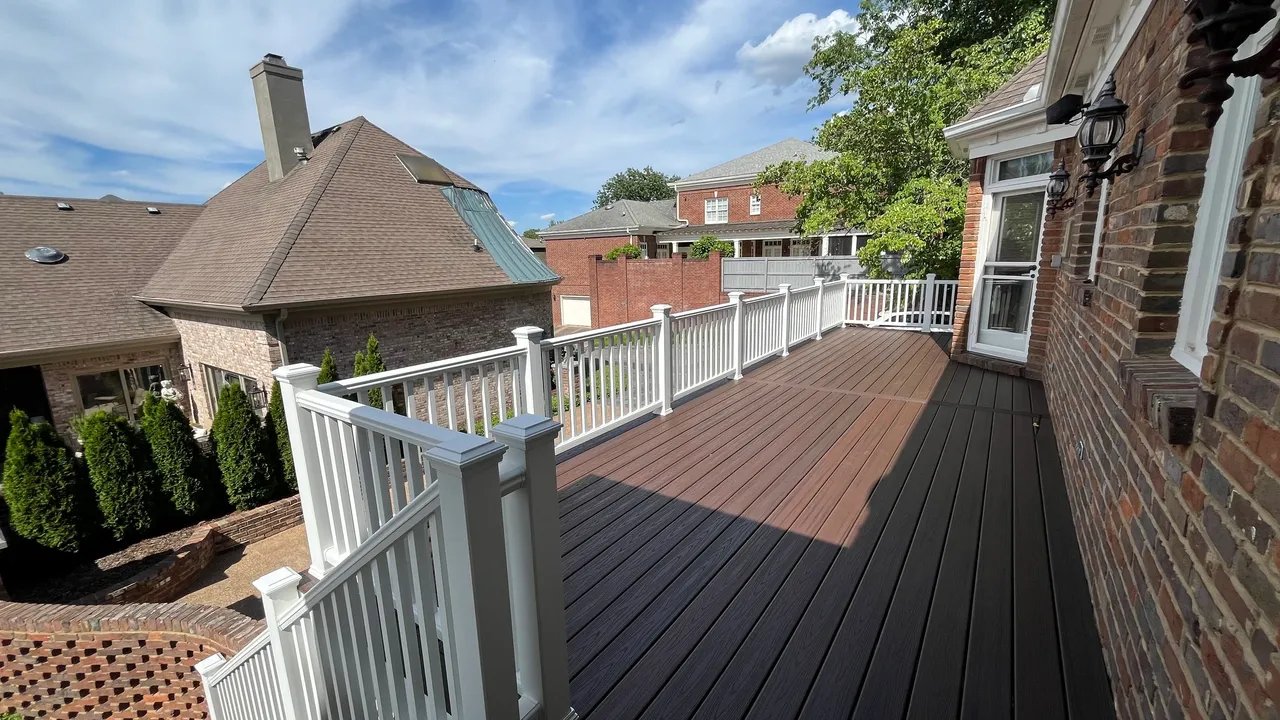 Scenic view of a deck with railing overlooking rooftops