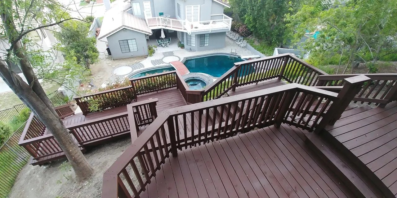 Aerial view of wooden staircases leading to a pool