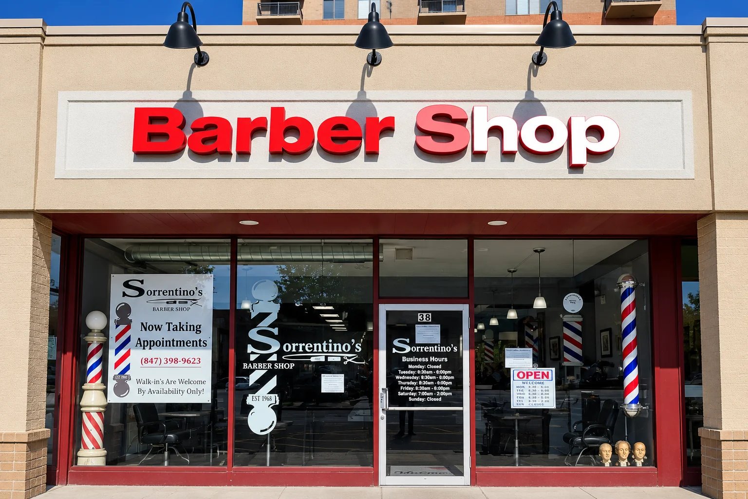 Barber shop storefront with red signage.