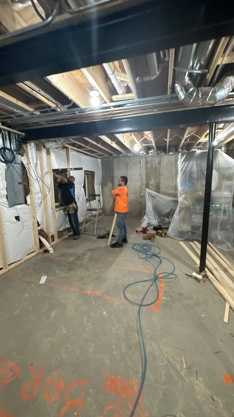 Workers engaged in basement renovation