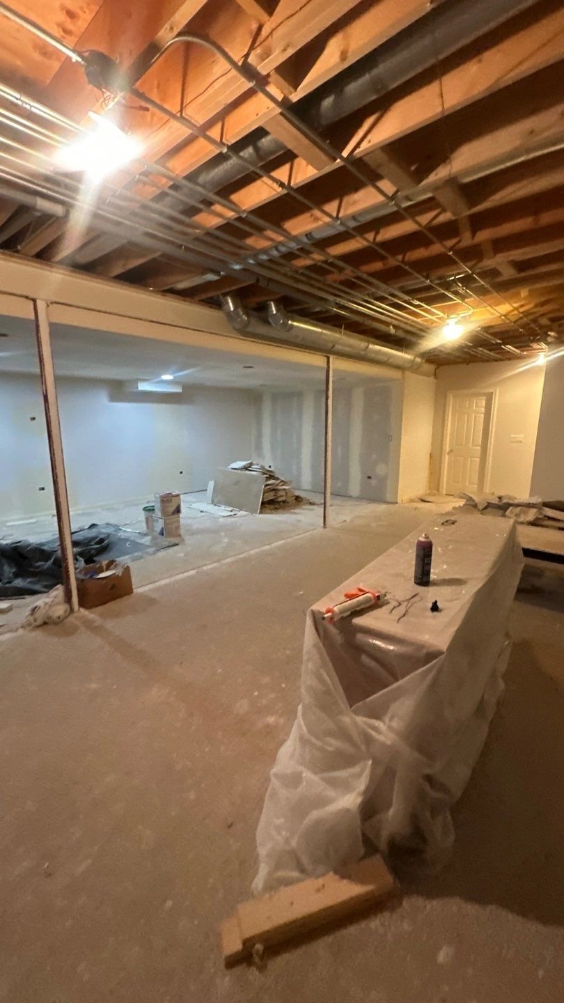 Interior view of a basement renovation in progress.