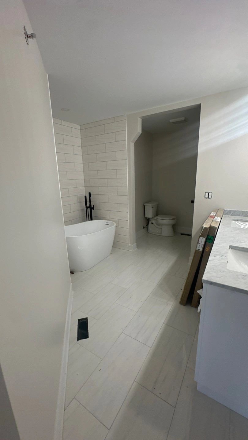 Modern bathroom with freestanding tub and toilet