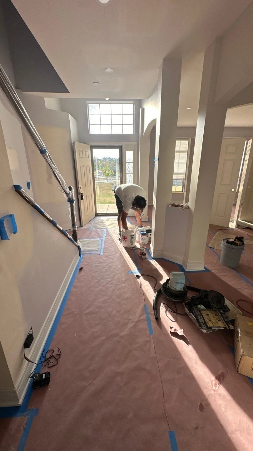 Painter working in a newly renovated interior space