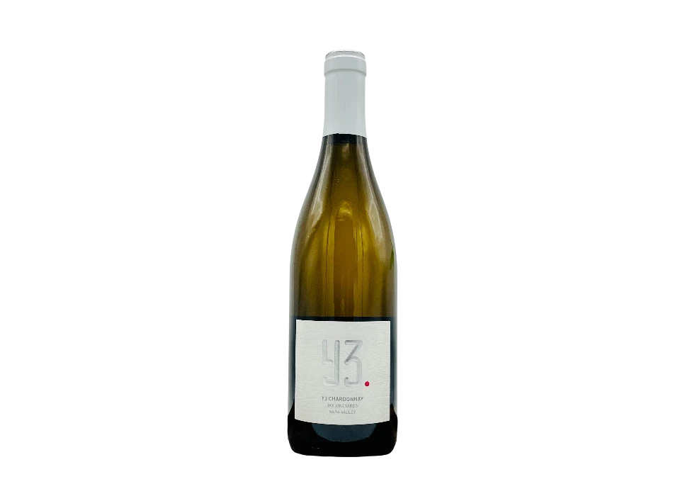 Bottle of Chardonnay wine on a black background