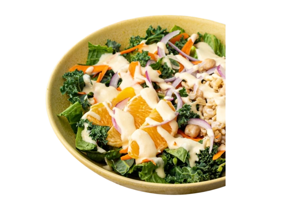 Colorful salad with kale, oranges, and vegetables