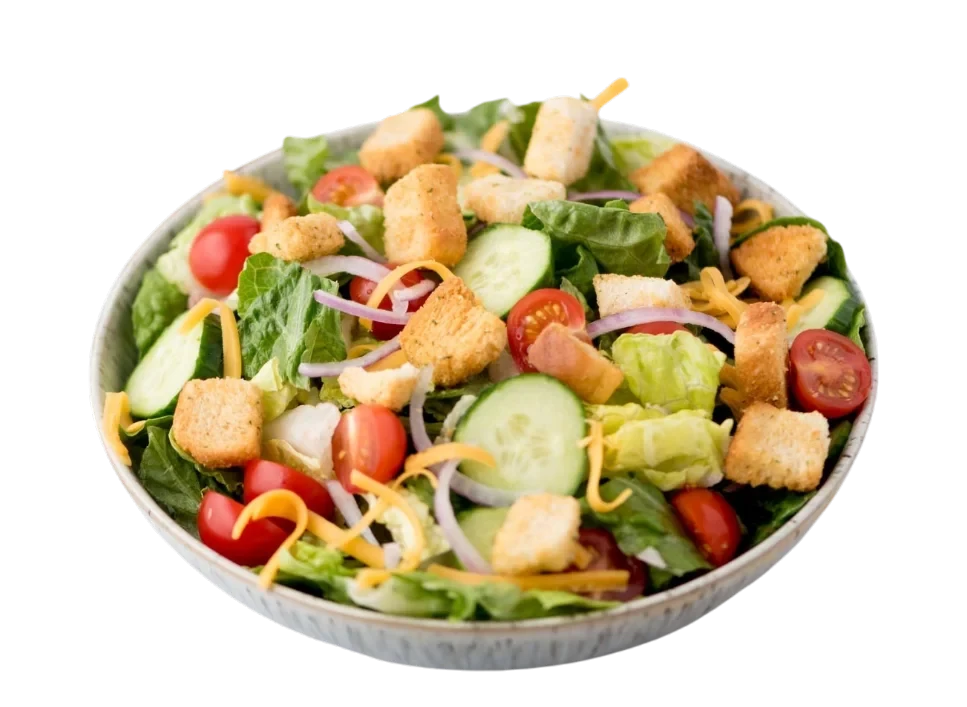 Fresh garden salad with cucumbers, tomatoes, and croutons