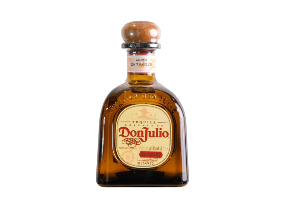 Bottle of Don Julio tequila on a black background