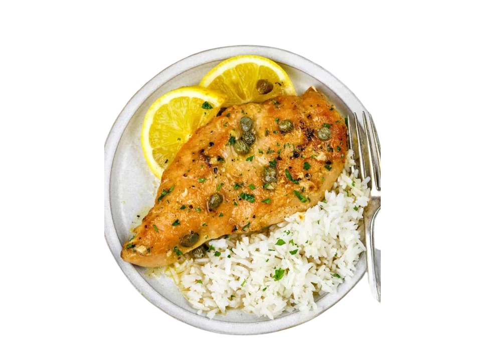 Grilled fish fillet with rice and lemon slices