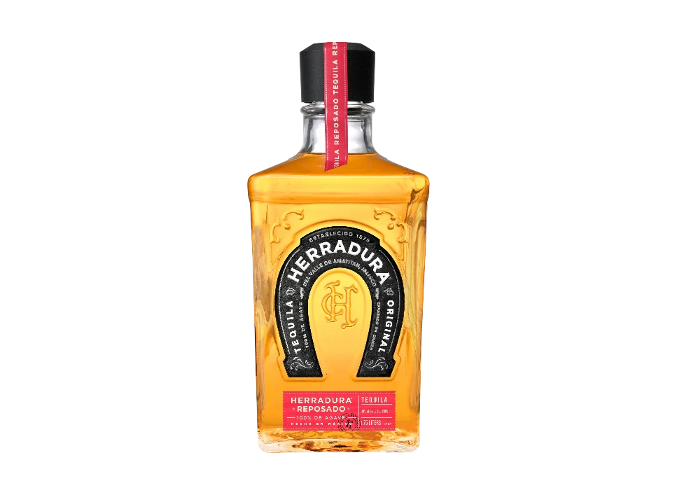 Bottle of Herradura Reposado tequila on a black background