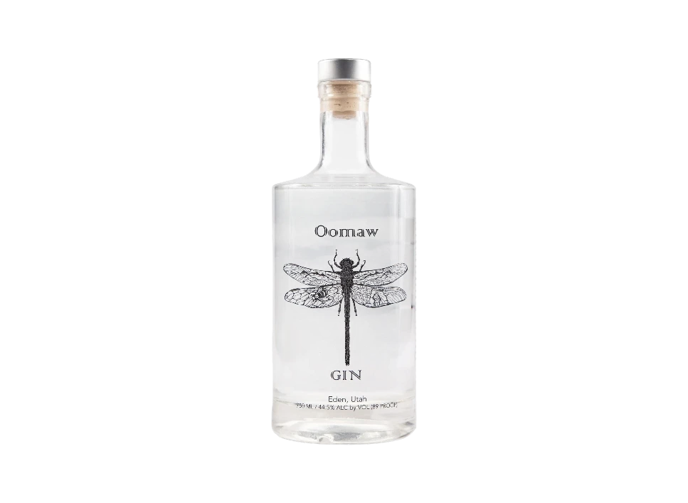 Oomaw gin bottle with a detailed dragonfly design.