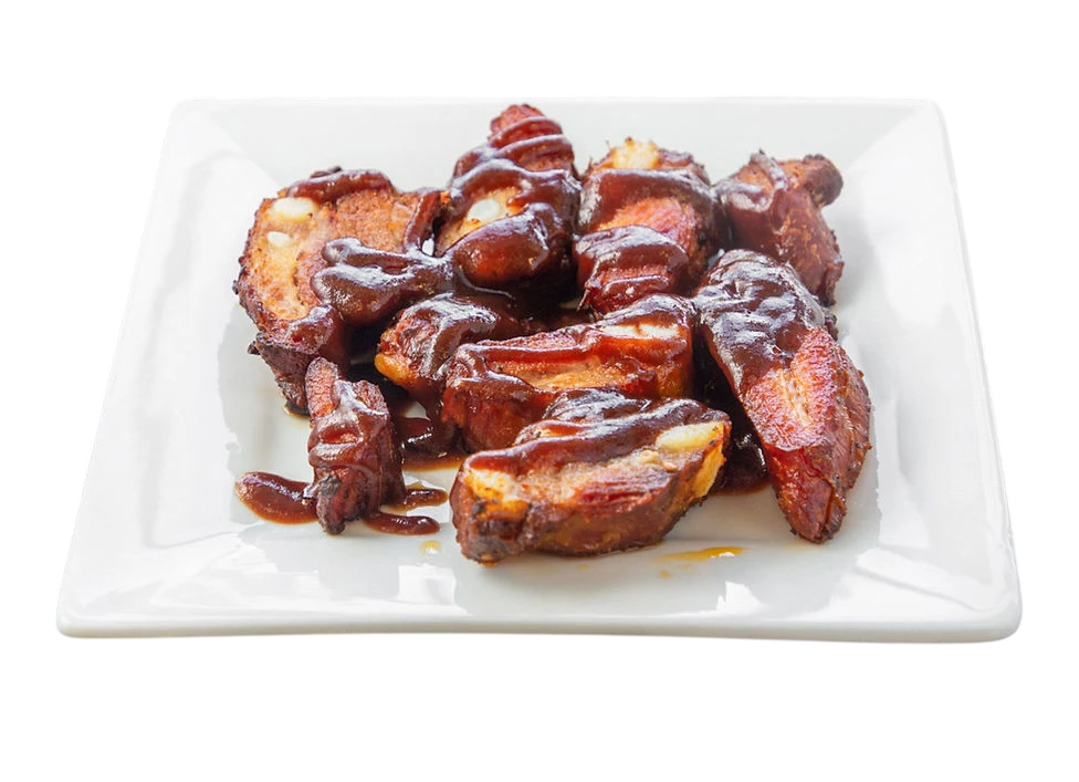 Delicious pork ribs with barbecue sauce served on a plate.