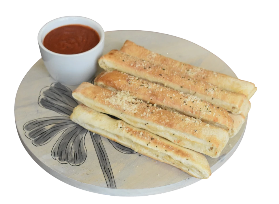 Delicious cheesy breadsticks with marinara sauce